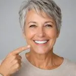 Smiling Senior Woman Showing Bright White Teeth After Cosmetic Dentistry