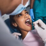 Young woman smiling during dental checkup at preventive dentistry office